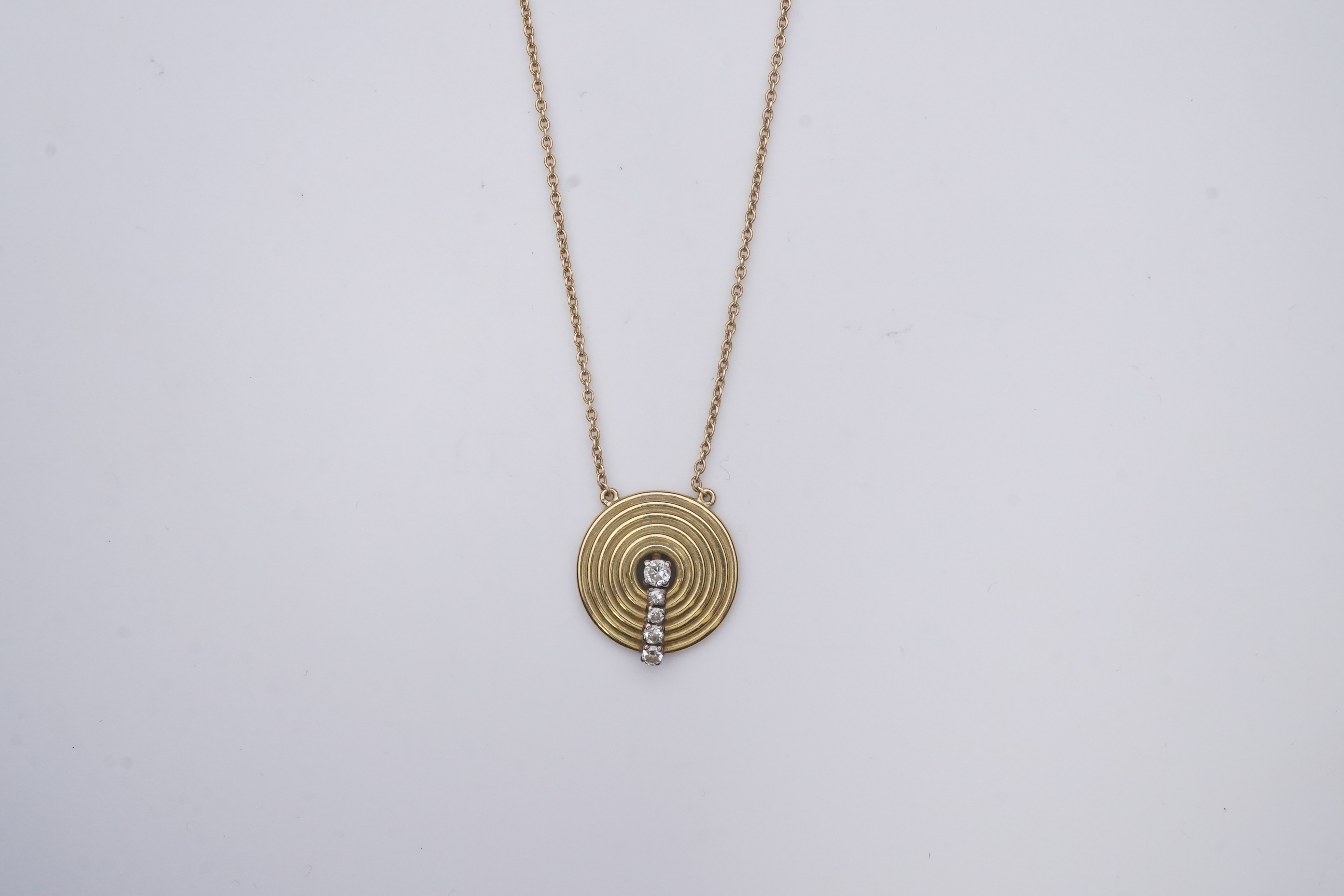 An 18ct gold and diamond pendant, circa 1978